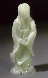 20th century A pale celadon jade carving of Guanyin